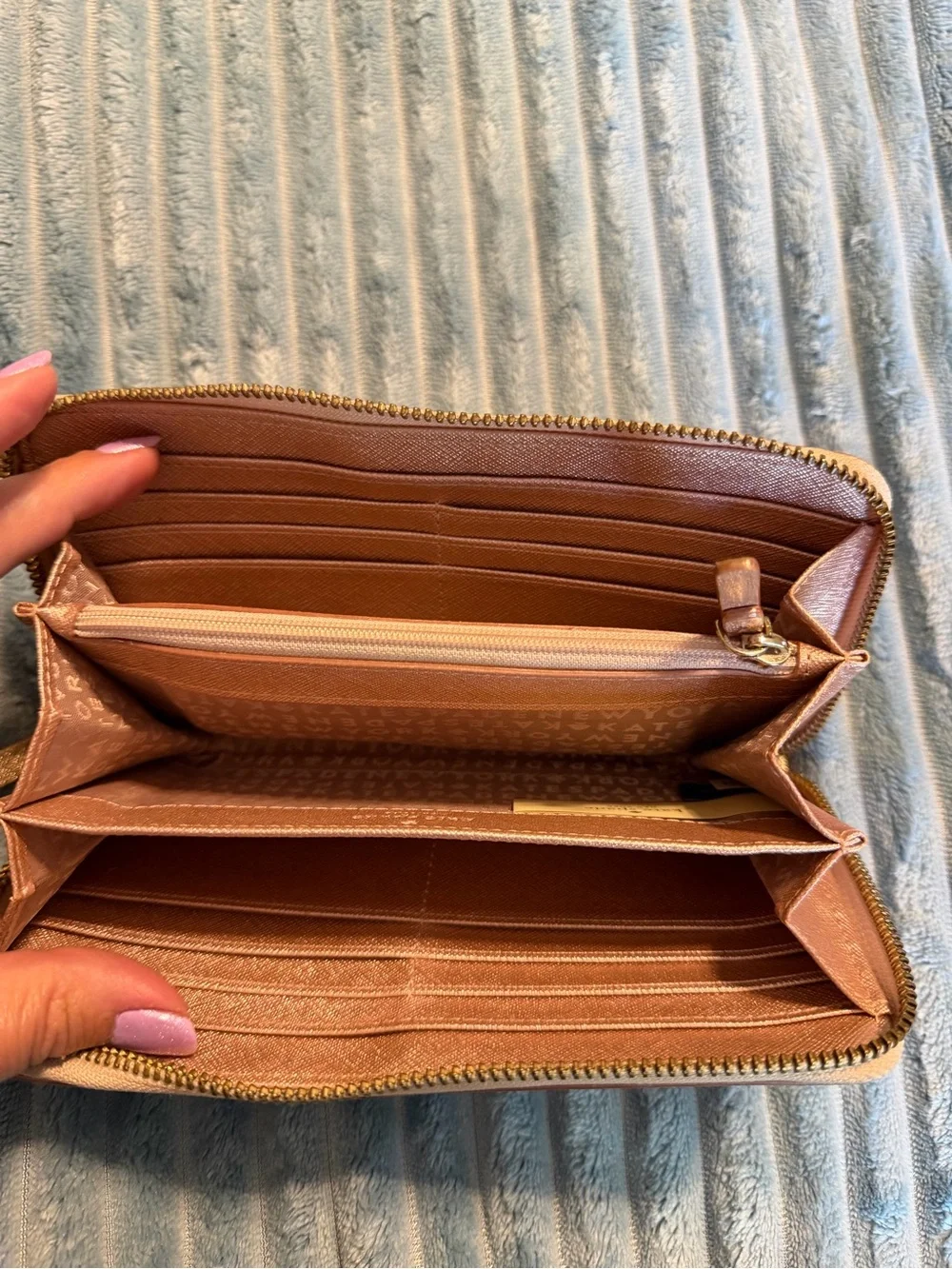 kate spade metallic rose gold zip-around wallet